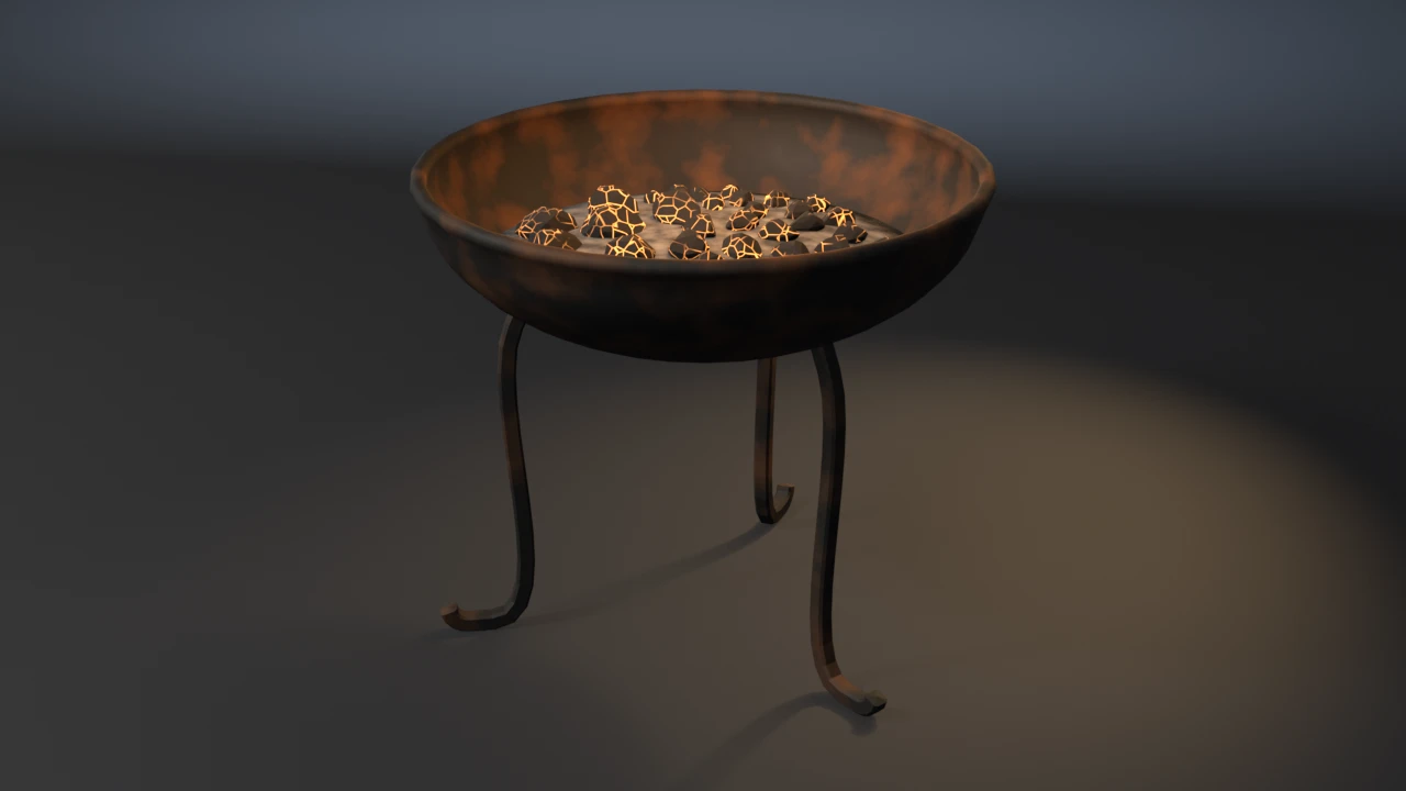 An iron fire bowl with a rolled rim on three S-curved forged legs with curled feet, filled with ash and a heap of charcoal glowing orange in its cracks.