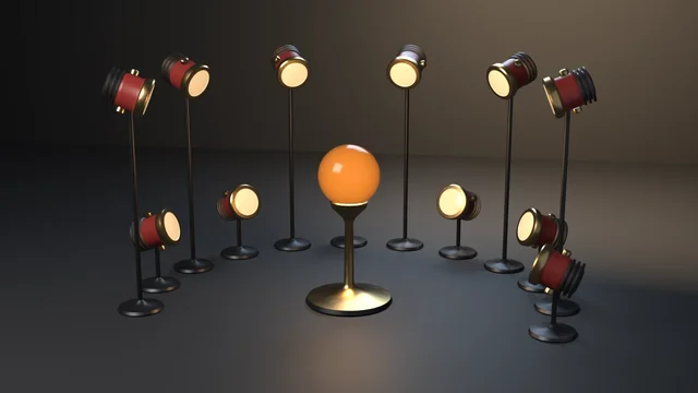 Twelve red-and-brass spotlight heads on low and high stands in an open ring, every lens swung to face a glowing amber orb on a brass pedestal.