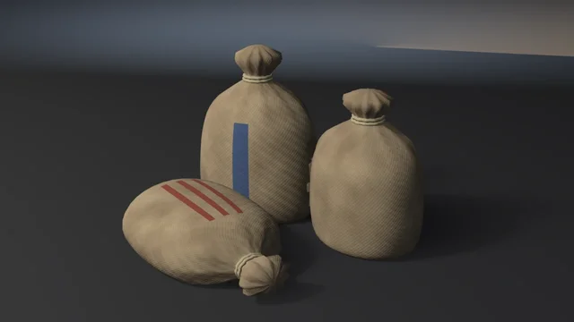 Three burlap grain sacks tied at the neck with twine, two standing and one lying in front, with a blue stripe on one and red stripes on the other.