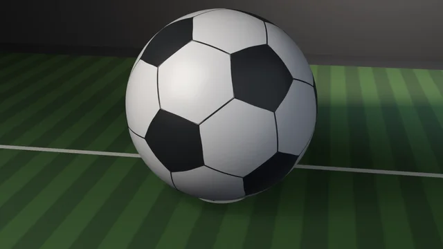 A white soccer ball with black pentagon panels and dark stitched seams, pressed into mown pitch turf on a chalked penalty spot with a touchline behind it.