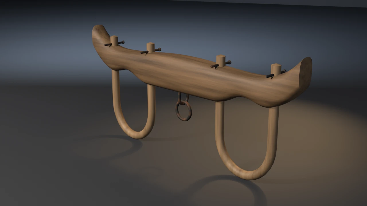 A carved oak ox yoke with upturned ends standing on two bent hickory bows pinned above the beam, with a rusted iron ring hung from a staple under its centre.